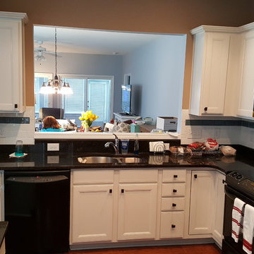 White Cabinets with Black Handles and Appliances