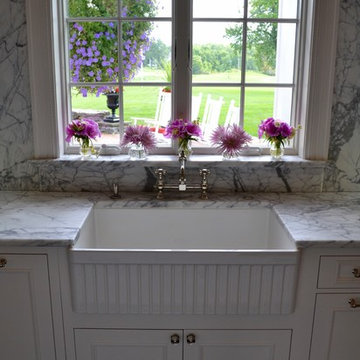 White Framhouse Sink in Traditional Kitchen with White Recessed Panel Cabinets