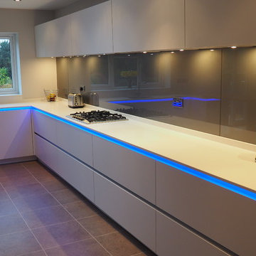 White handleless kitchen with LED lit worktop