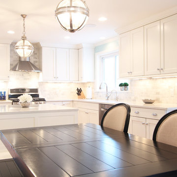 White Kitchen Cabinets to Ceiling with Tumbled Marble Backsplash