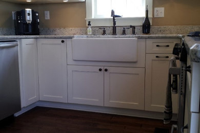 White Kitchen Cabinets with Farmhouse Sink and Hardwood Floors