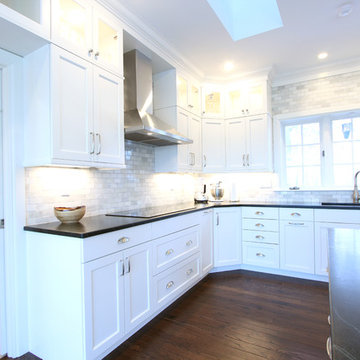White Kitchen Cabinets with Marble Subway Tile and Soapstone Countertop