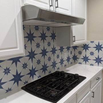 White kitchen - calcatta quartz, Salerno tile and extended cabinetry