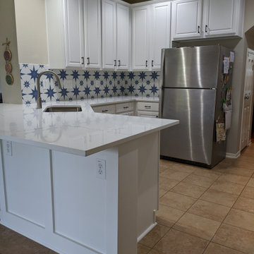 White kitchen - calcatta quartz, Salerno tile and extended cabinetry