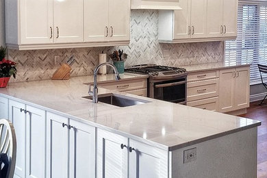 Mid-sized elegant l-shaped medium tone wood floor and brown floor eat-in kitchen photo in Toronto with an undermount sink, flat-panel cabinets, white cabinets, quartz countertops, stainless steel appliances, a peninsula and multicolored countertops