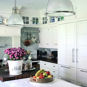 white kitchen marble countertop, sub zero, wood countertop