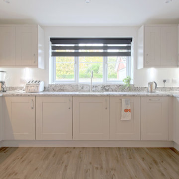 White Kitchen with a Marble worktop