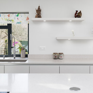 White kitchen with bespoke curved island