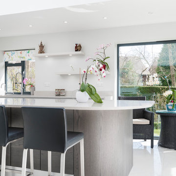 White kitchen with bespoke curved island