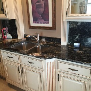 White Kitchen with Black Granite Countertops