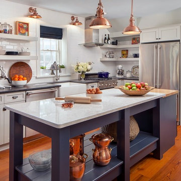 White kitchen with copper and navy  blue accents