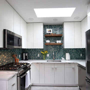 White kitchen with cosmic blue tile