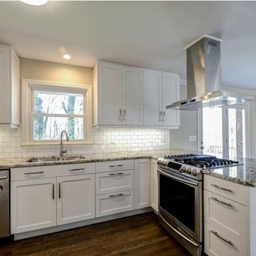 White kitchen with exotic granite