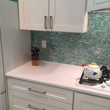 White Kitchen with Teal Backsplash