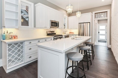 Enclosed kitchen - mid-sized l-shaped enclosed kitchen idea in Toronto with shaker cabinets, white cabinets, quartz countertops, an island and white countertops
