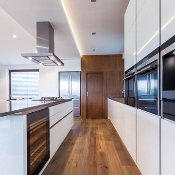 White modern kitchen with walnut veneer