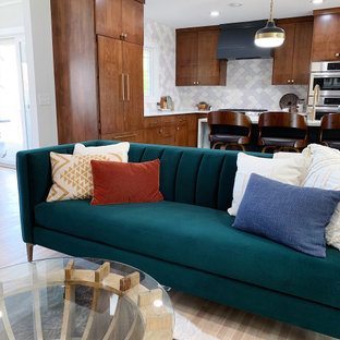 Design ideas for a large midcentury l-shaped open plan kitchen in Minneapolis with a drop-in sink, flat-panel cabinets, dark wood cabinets, onyx benchtops, white splashback, ceramic splashback, stainless steel appliances, dark hardwood floors, with island, brown floor and white benchtop.