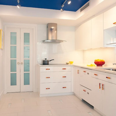 Kitchen - eclectic kitchen idea in Boston with a single-bowl sink, flat-panel cabinets, white cabinets, white backsplash and white appliances