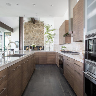 Contemporary open concept kitchen ideas - Trendy u-shaped dark wood floor open concept kitchen photo in Salt Lake City with an undermount sink, flat-panel cabinets, medium tone wood cabinets, beige backsplash, stainless steel appliances and an island