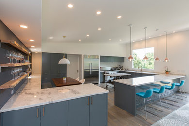 Open concept kitchen - large modern u-shaped light wood floor open concept kitchen idea in San Francisco with a double-bowl sink, flat-panel cabinets, blue cabinets, quartzite countertops, gray backsplash, stainless steel appliances and an island
