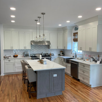 white shaker kitchen cabinets combine with grey shaker cabinets .