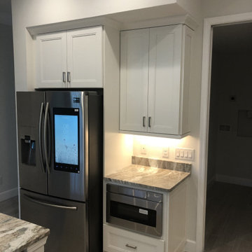 White Shaker Style Cabinets with Gray Countertops