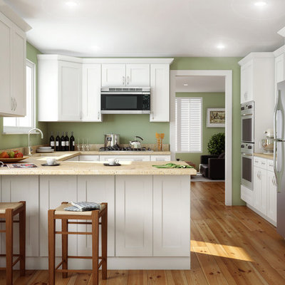 Mid-sized arts and crafts u-shaped light wood floor and beige floor kitchen photo in Other with shaker cabinets, white cabinets, stainless steel appliances, a peninsula, an undermount sink and quartz countertops