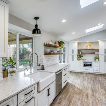 White Transitional Galley Kitchen and Outdoor Living Space
