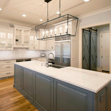 White Transitional Kitchen Featuring Double Islands and Custom Barn Doors