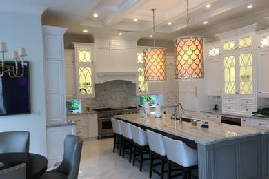 Eat-in kitchen - large transitional u-shaped marble floor and white floor eat-in kitchen idea in Miami with an undermount sink, recessed-panel cabinets, white cabinets, marble countertops, gray backsplash, stone tile backsplash, paneled appliances and an island