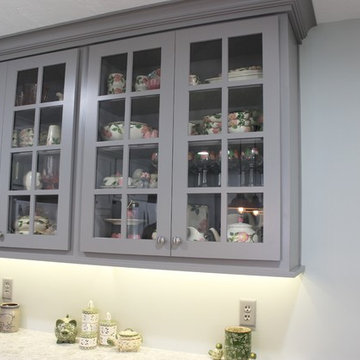 White Upper Cabinet and Gray Base Cabinet Kitchen With Quartz Counters