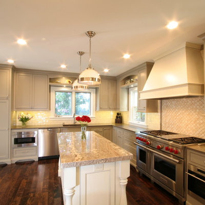 Eat-in kitchen - large traditional l-shaped dark wood floor eat-in kitchen idea in Milwaukee with an undermount sink, beaded inset cabinets, gray cabinets, granite countertops, white backsplash, subway tile backsplash, stainless steel appliances and an island