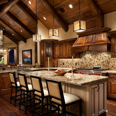 Example of a mountain style open concept kitchen design in Other with raised-panel cabinets, dark wood cabinets, brown backsplash and mosaic tile backsplash