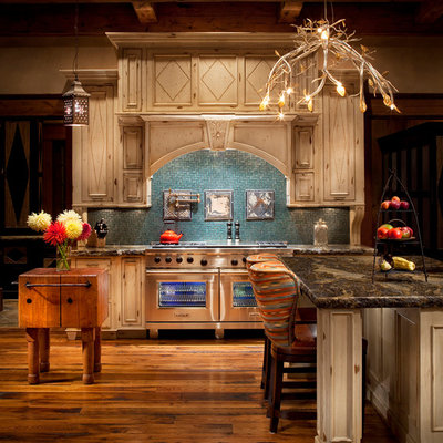 Kitchen - rustic kitchen idea in Other with beige cabinets, blue backsplash and stainless steel appliances