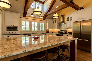 Example of an arts and crafts kitchen design in Milwaukee with stainless steel appliances