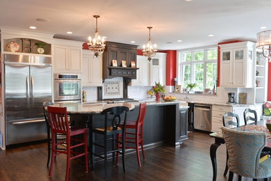 Large elegant l-shaped dark wood floor eat-in kitchen photo in Milwaukee with an undermount sink, raised-panel cabinets, white cabinets, granite countertops, white backsplash, subway tile backsplash, stainless steel appliances and an island