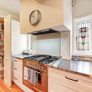 Traditional kitchen with stainless steel benchtop
