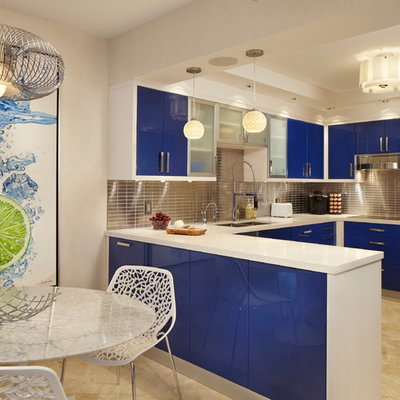Mid-sized trendy u-shaped marble floor eat-in kitchen photo in Miami with flat-panel cabinets, blue cabinets, metallic backsplash, metal backsplash, a drop-in sink, quartzite countertops, stainless steel appliances and a peninsula