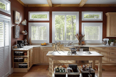 Example of a cottage light wood floor kitchen design in Calgary with a double-bowl sink, recessed-panel cabinets, light wood cabinets and an island