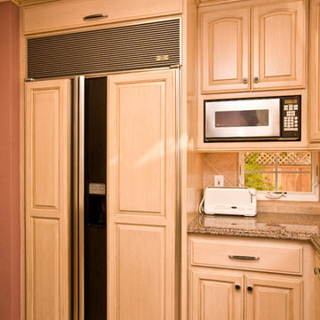 Wine themed kitchen with wine cooler and grape tile details
