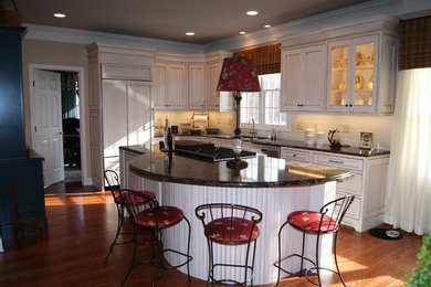 Eat-in kitchen - traditional eat-in kitchen idea in Other with a double-bowl sink and quartzite countertops