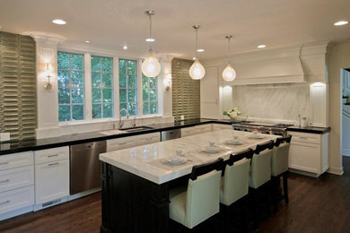 Kitchen - mid-sized transitional u-shaped medium tone wood floor kitchen idea in Chicago with an undermount sink, recessed-panel cabinets, white cabinets, marble countertops, green backsplash, ceramic backsplash, stainless steel appliances and an island