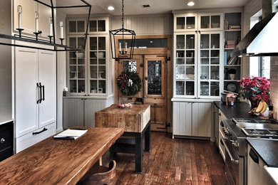 Inspiration for a transitional dark wood floor kitchen remodel in Dallas with a farmhouse sink, shaker cabinets and granite countertops