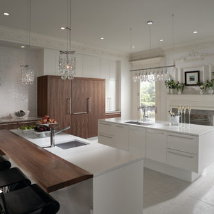 Inspiration for a large modern l-shaped porcelain tile and gray floor eat-in kitchen remodel in Houston with a single-bowl sink, flat-panel cabinets, brown cabinets, quartz countertops, white backsplash, porcelain backsplash, stainless steel appliances and two islands