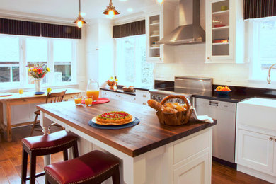 Wood Countertop Island in Traditional White Kitchen
