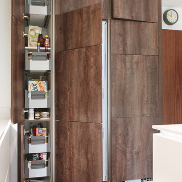 Wood effect matt kitchen with tall storage units