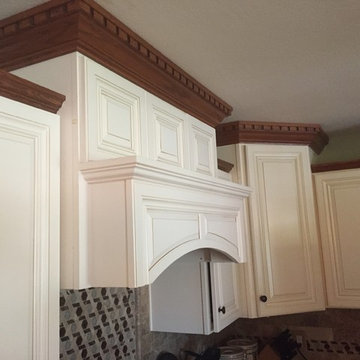 Wood Hood, Staggered Wall Cabinets, and Crown Moulding