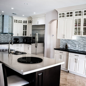 Wooden kitchen cabinets in two colors with Granite and Quartz table tops