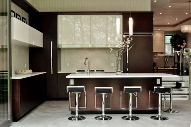 Inspiration for a contemporary l-shaped kitchen in Toronto with flat-panel cabinets and white cabinets.