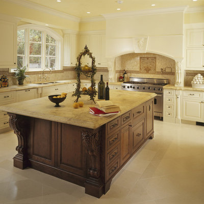 Large elegant u-shaped porcelain tile kitchen photo in Los Angeles with stainless steel appliances, an undermount sink, raised-panel cabinets, white cabinets, beige backsplash, marble countertops, porcelain backsplash and an island